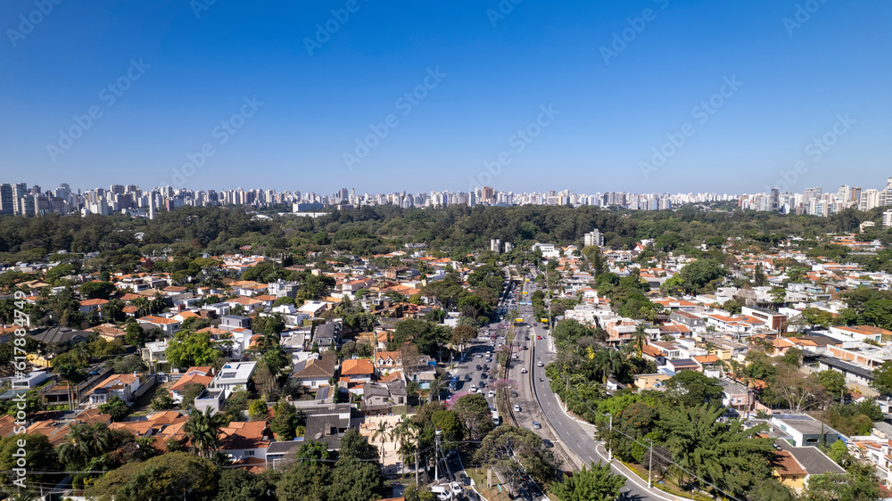 Fototapeta premium Residential buildings and houses in the Itaim Bibi neighborhood in São Paulo, Brazil. Aerial view of Ibirapuera Park with buildings in the background.