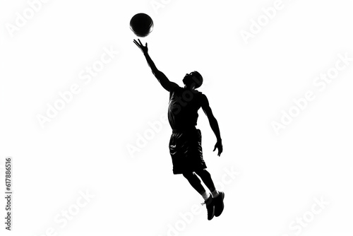 silhouette of a person doing a lay up shot , basketball player