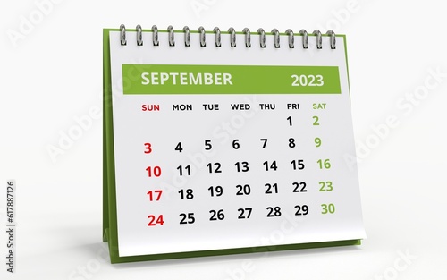 Standing Desk Calendar September 2023. Business monthly calendar with metal spiral-bound, the week starts on Sunday. Monthly Pages on a white base and green title, isolated on white background, 3d ren