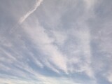 Cirrus or cirrocumulus clouds at noon