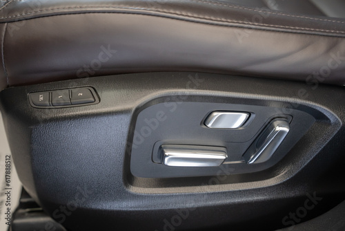 a close up of a car chair control panel 