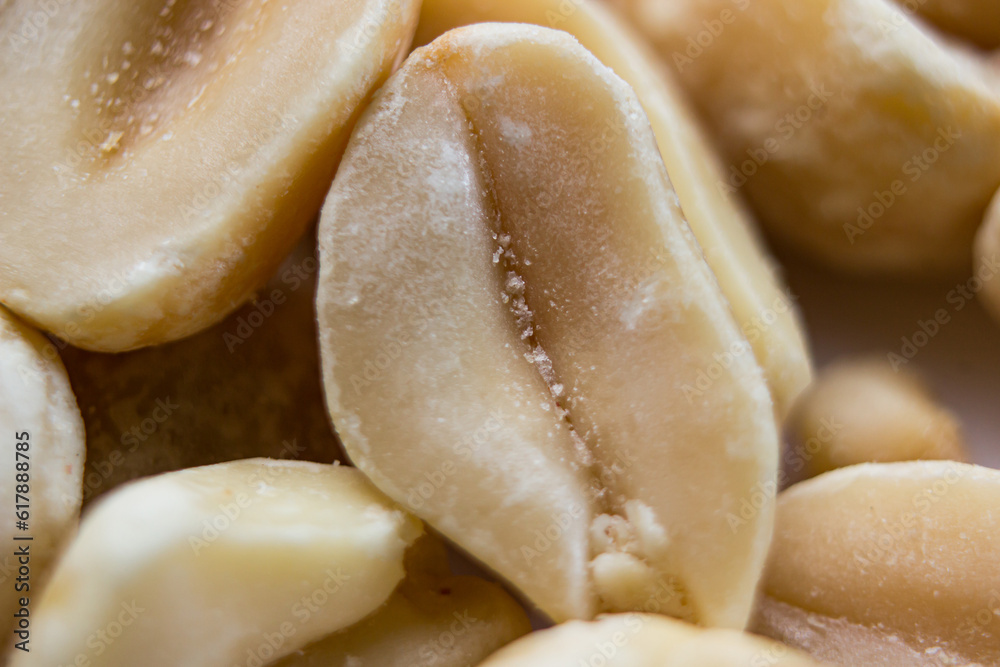 Peanuts close-up on a white background. Salty beer snack Peanuts close-up on a white background. Salty beer snack