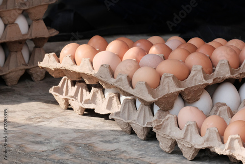 Chicken brown eggs in paper packaging. The concept of a farmer's market, a dietary product.
