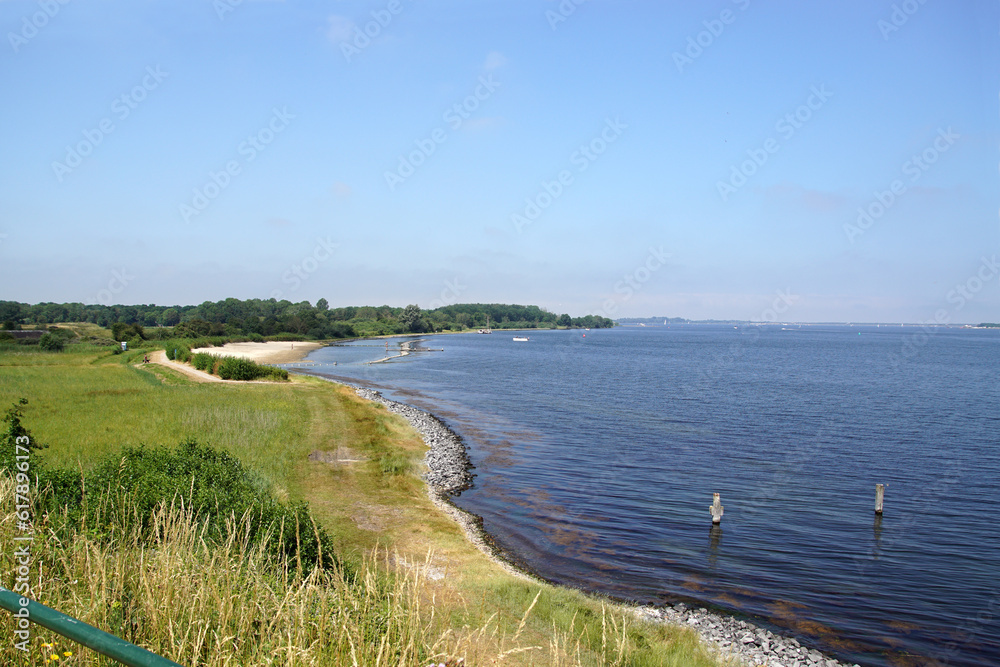 View of the sandy beach called Bastionstrand (Bastion beach) at the Zeeland lake called Veerse Meer. Near the city of Veere. Grass, Nature. Netherlands, Summer, June