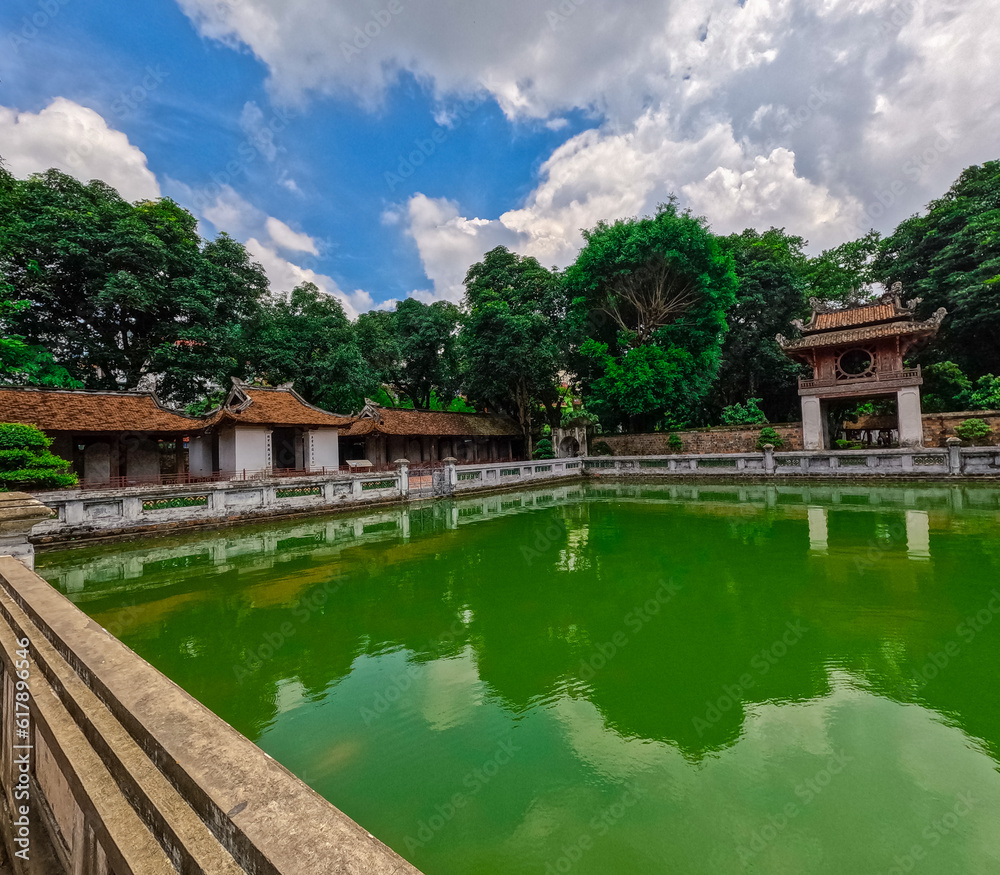 Fototapeta premium Literature Temple surrounded by beautiful gardens old historic buildings Bonsai plants and old trees in Hanoi Vietnam 