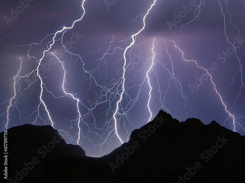 Photography lightning in the night over mountains