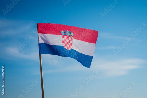 National flag of Croatia on blue sky background.