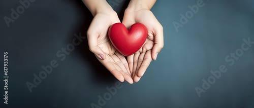 hands holding red heart, health care, love, organ donation, mindfulness, wellbeing, family insurance and CSR concept, world heart day, world health day, world mental health day, praying concept. photo