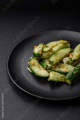Delicious juicy cucumber cut into large slices with salt, spices and french mustard