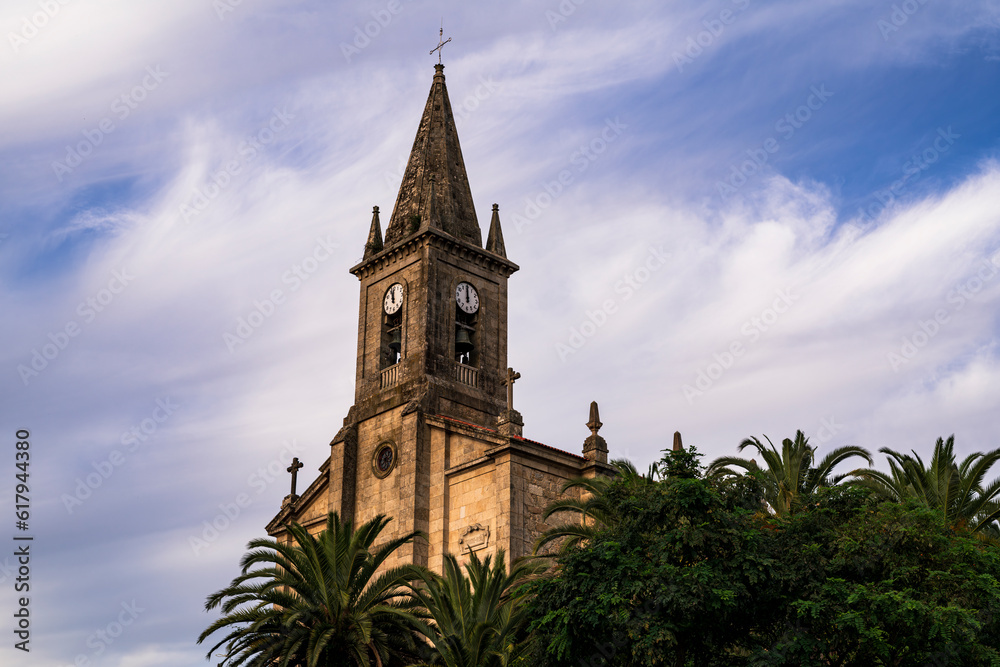 View of a beautiful Church and its bell tower in the small town of Caldas del Rey. Photograph taken in Pontevedra, Spain.