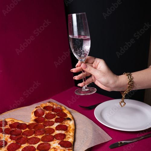 Valentine Day pizza or restaurant concept. love shape pizza isolated on red background concept of valentine day.