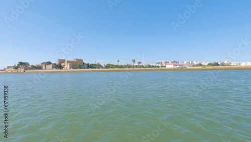 Boat seascape view of Faro City Old Town, shot from the Ria Formosa natural park, in Algarve Tourism Destination Region, Portugal.