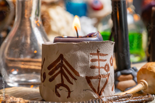 Tableau sur toile Witchcraft altar selective focus to details of candles light and magic tools or items