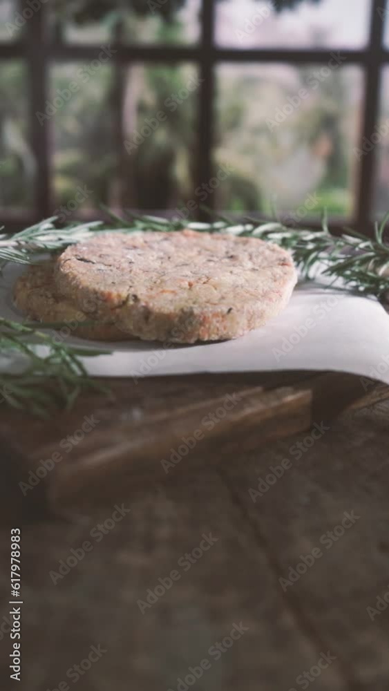 delicious healthy vegetarian vegan homemade burger on a wooden plate decorated with rosemary and lavender vertical delicious healthy vegetarian vegan homemade burger on a wooden plate decorated with rosemary and lavender vertical