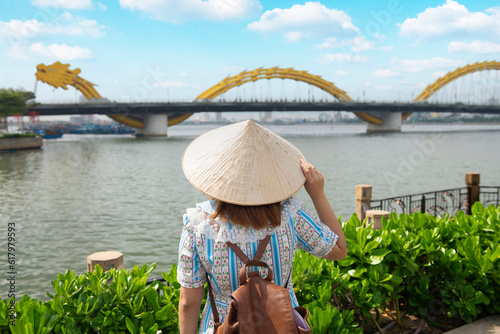 Tourist woman is enjoy traveling and sightseeing at Dragon bridge which is one of the most beautiful destination of Da Nang city,Vietnam