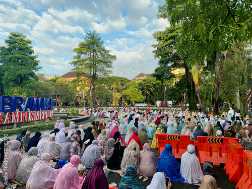 sholat idul fitri. indonesian muslim community are doing eid al fitr prayer in outdoor area. sholat idul adha 