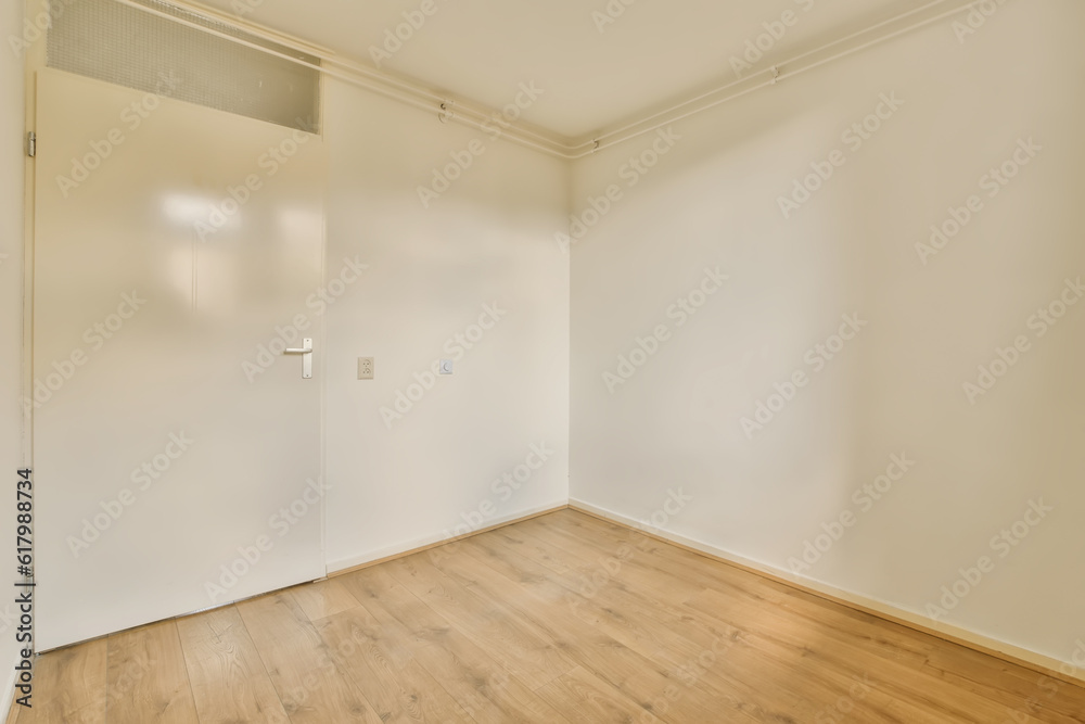 an empty room with wood floors and white walls, the door is open to reveal a closet in the corner an empty room with wood floors and white walls, the door is open to reveal a closet in the corner