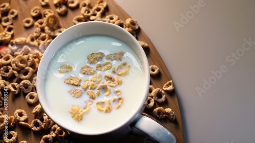 Cup with cereal and milk. Morning light