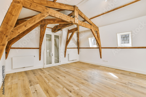 an empty room with wood flooring and exposed beams on the ceiling in this is one of the best things to do when you're