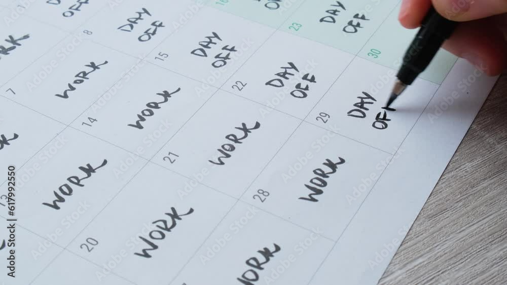 4 day work week printed calendar with weekend days four day working week concept. Female hand writing planning Modern approach doing business short workweek. Effectiveness of employees. Productivity 4 day work week printed calendar with weekend days four day working week concept. Female hand writing planning Modern approach doing business short workweek. Effectiveness of employees. Productivity