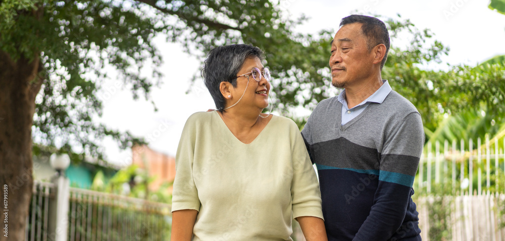 Senior happy love asian senior couple relaxing and talking together walk in park at home, wife, family, elderly, care, health, insurance.Retirement healthcare couple concept Senior happy love asian senior couple relaxing and talking together walk in park at home, wife, family, elderly, care, health, insurance.Retirement healthcare couple concept