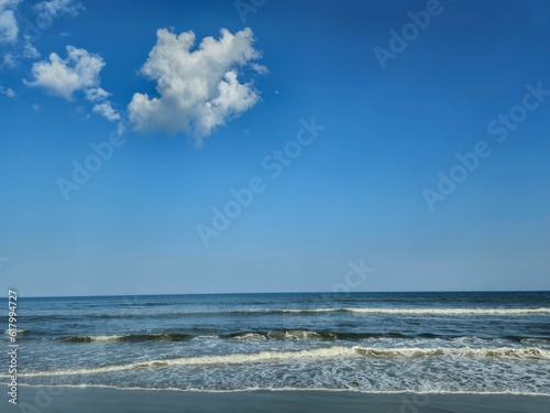 Incoming Ocean Waves and Small Clouds at Hilton Head Island