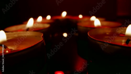 Candles close-up. The flight of the camera along the burning candles. Macro photography of the flame. photo