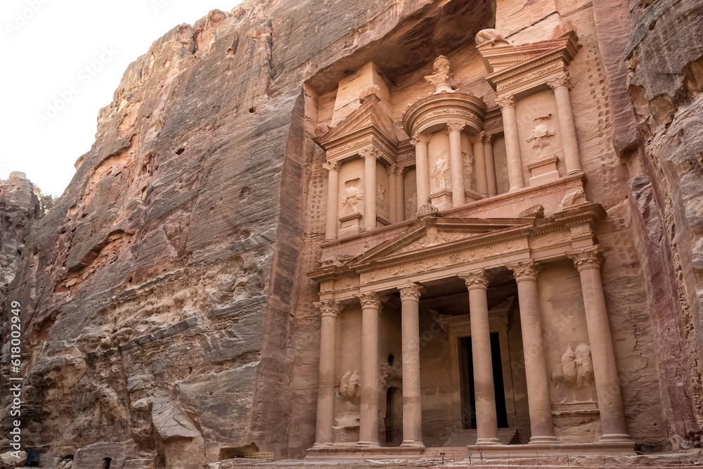 View of Al-Khazneh (The Treasury), one of the most elaborate temples in Petra, an ancient city of the Nabatean Kingdom, in Jordan. This structure was carved out of a sandstone rock face