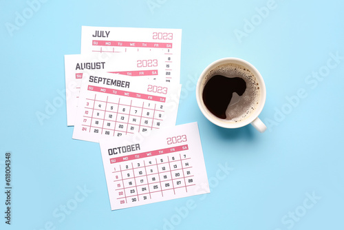 Pages of calendar and cup o...