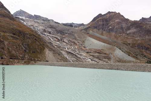 Reservoir Mattmark dam lake and mountain panorama view near Saas-Fee, Pennine Alps, Switzerland photo