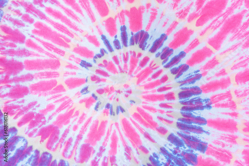 Pink spiral tie dye pattern abstract background.