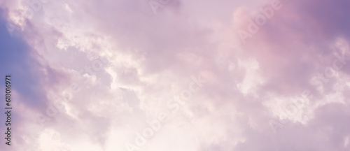 Background of a beautiful pink and pale purple sky with clouds at sunset