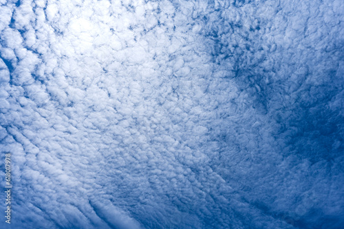 Flowing clouds on blue sky background.