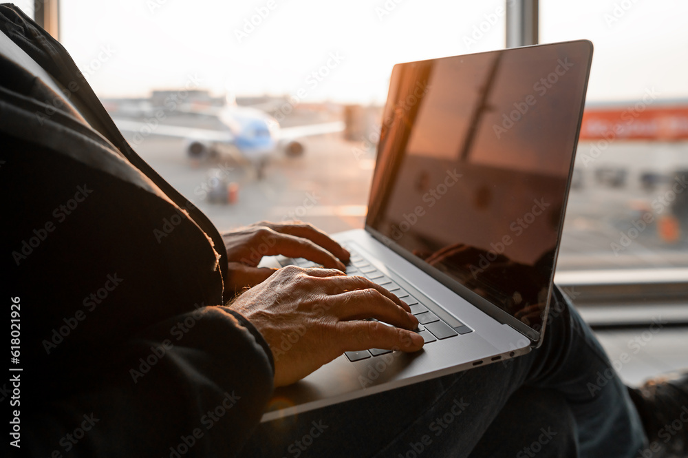 Airport Terminal: Businessman Uses Laptop Computer, Waiting for His ...
