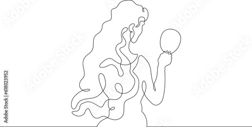 The woman looks in the mirror. Girl with a mirror in her hand. Make up in front of the mirror.One continuous line. Linear.One continuous line drawn isolated, white background.
