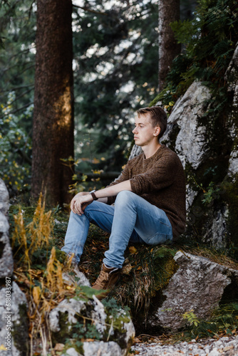 young male tourist on a walk in the Austrian forests