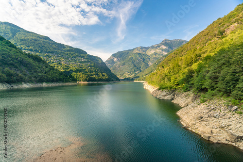 Lago di Vogorno lake in Ticino with green mountains surrounding photo