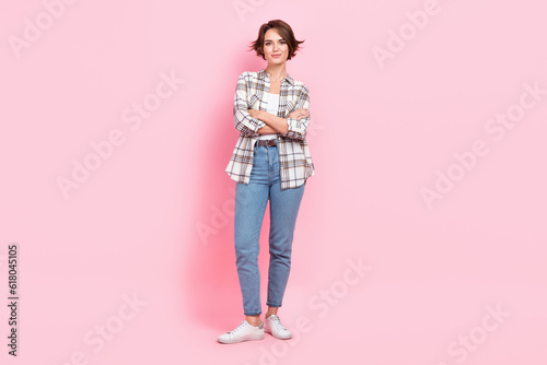 Full length photo of cheerful confident lady wear checkered jacket arms folded smiling isolated pink color background