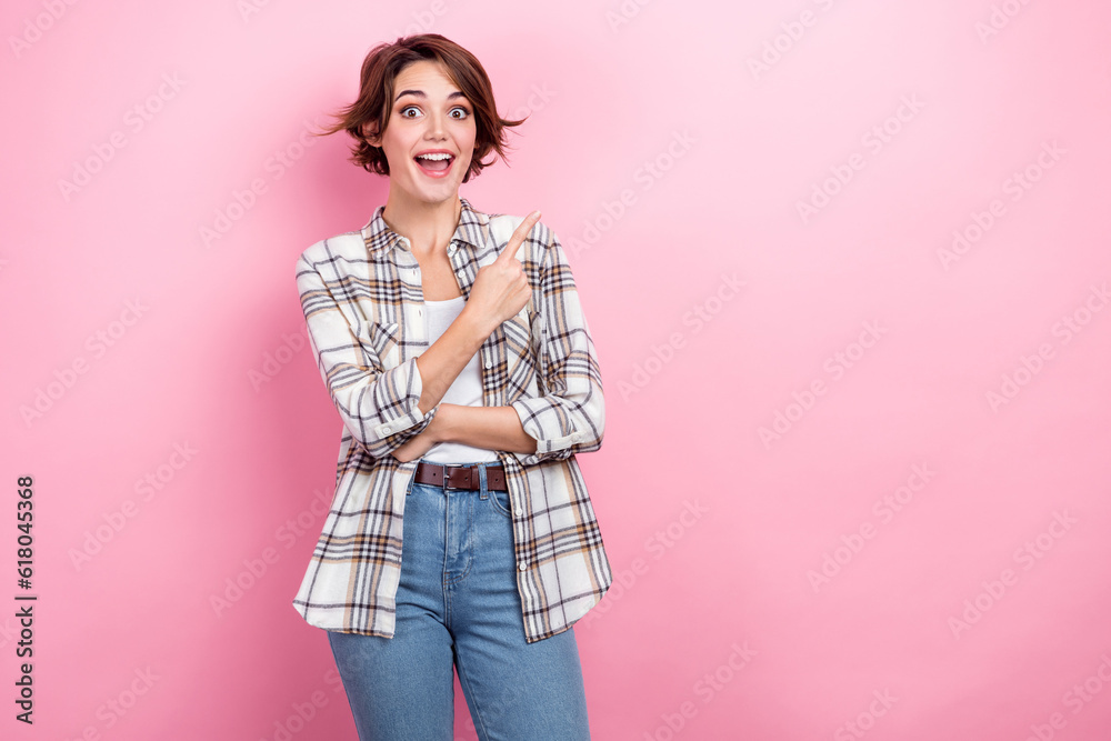 Photo of young business owner company brown hair lady pointing finger empty space proposition vacancy ad isolated on pink color background Photo of young business owner company brown hair lady pointing finger empty space proposition vacancy ad isolated on pink color background