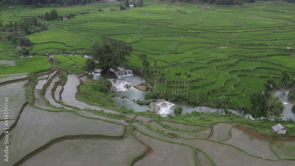 The Waikelo Sawah Waterfall at Sumba during a cloudy morning, aerial