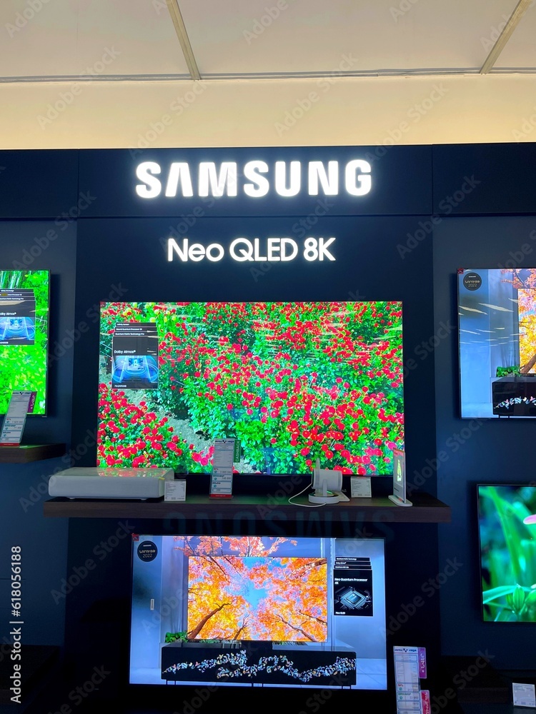 Samsung Neo QLED smart TVs in official store. Demo TV on branded wall