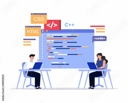 Software developers coding together sitting in front of their pc screens at the desk Software engineering