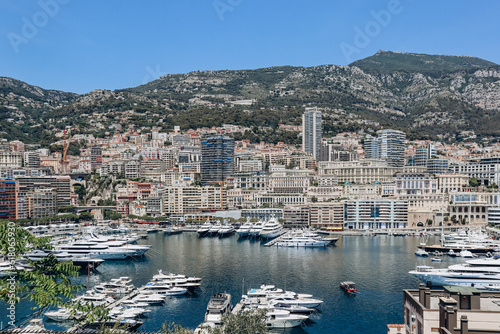 Fototapeta Naklejka Na Ścianę i Meble -  Monaco, Monaco - 25 June 2023: View of Port Hercule in Monaco on a sunny day