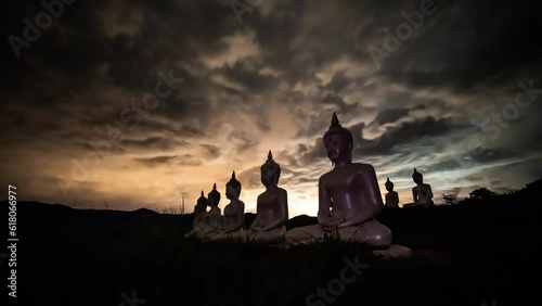 Buddha statues on the mountain with cloud sky at Phu Phra Ban Mak Khaeng, Dan Sai, Loei, Thailand. photo