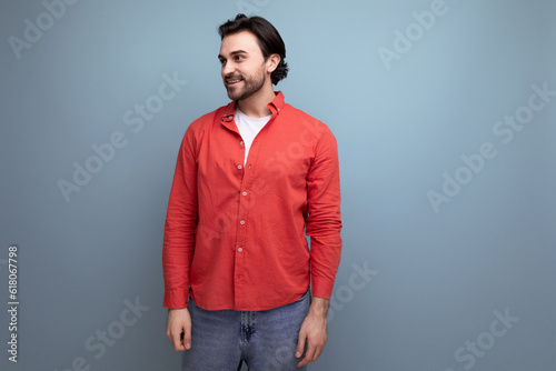 handsome brutal young brunette man in red shirt
