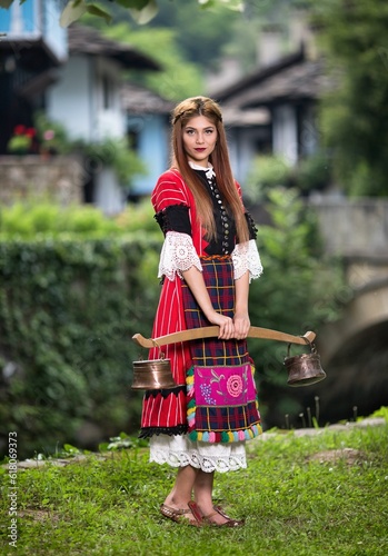 Bulgarian woman wearing a traditional costume in the Ethno village of Etar in Gabrovo, Bulgaria