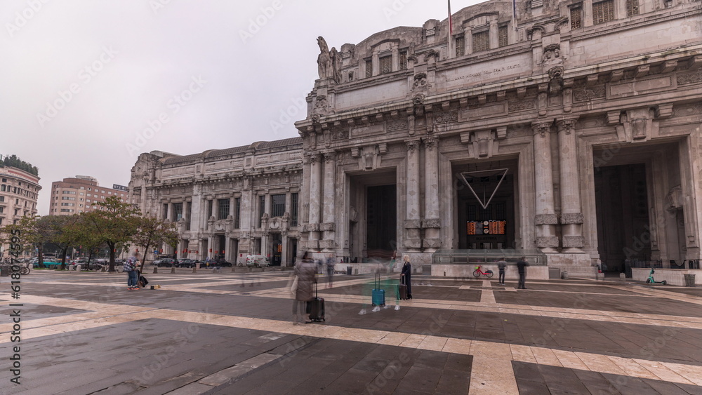 Panorama showing Milano Centrale timelapse - the main central railway station of the city of Milan in Italy. Panorama showing Milano Centrale timelapse - the main central railway station of the city of Milan in Italy.