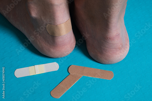 Grated calluses on women's heels, pasted leuco plaster photo