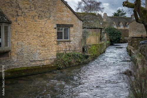 Peaceful river flows between two picturesque historic buildings