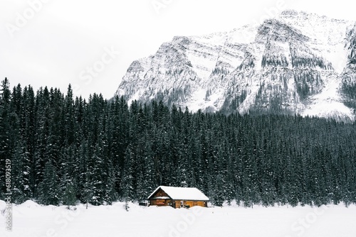 Picturesque cabin with a snow-covered backdrop in the stunning scenery of Lake Louise in Canada